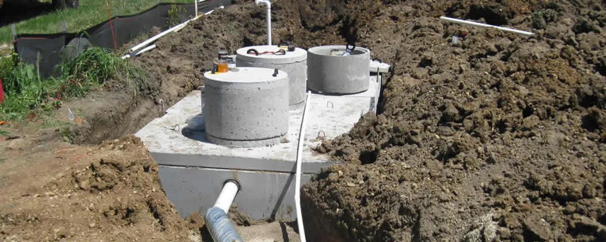 Septic system repair and installation site with tank access ports in Charlotte, NC